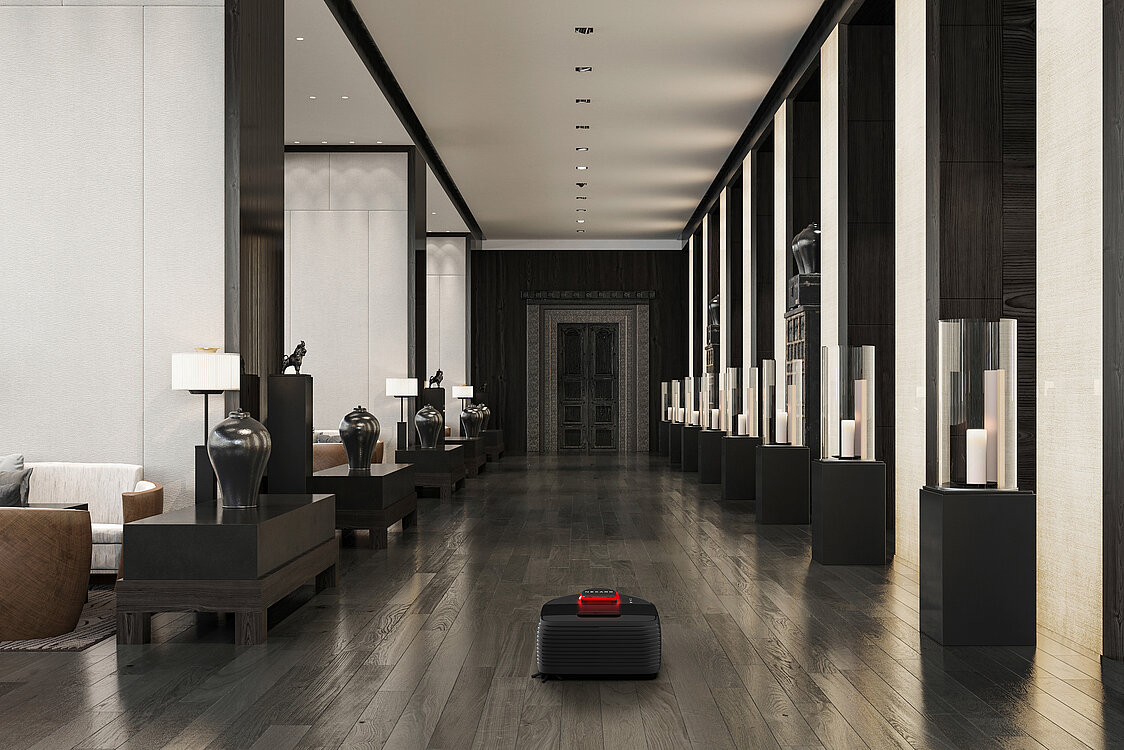 3D-Rendering eines schwarz-roten Staubsauger-Roboters von Nexaro, der den Fußboden eines modern eingerichteten Raumes reinigt.